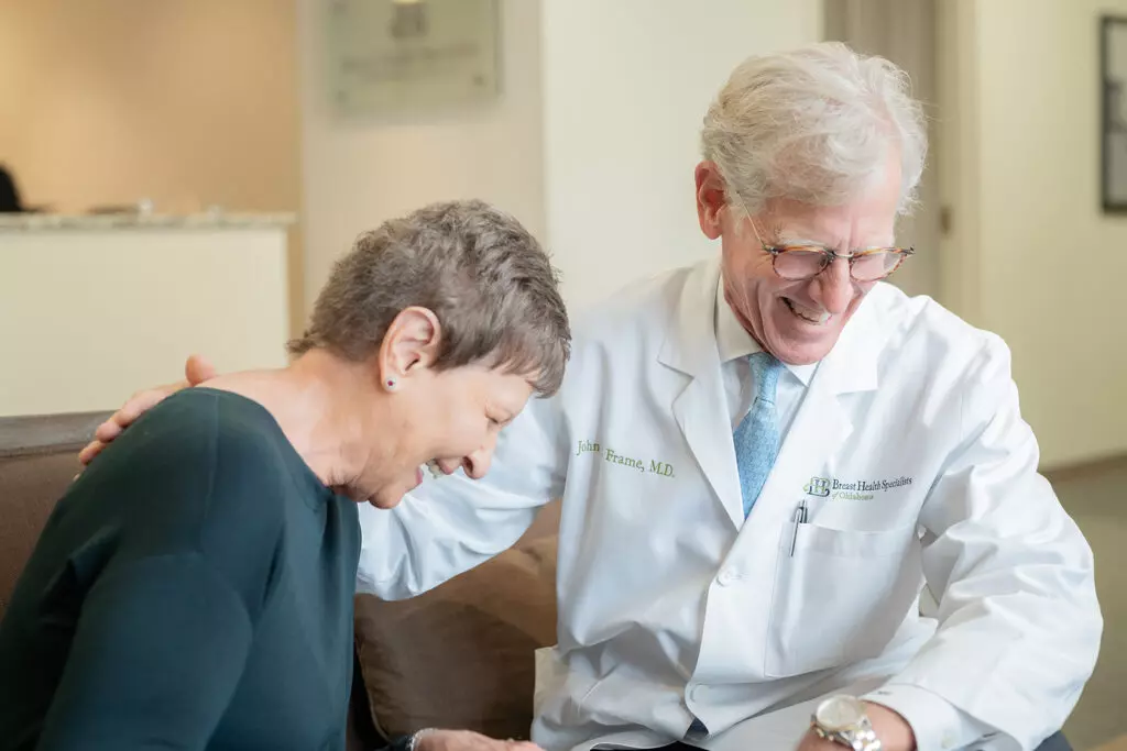 Dr Frame laughing with a patient